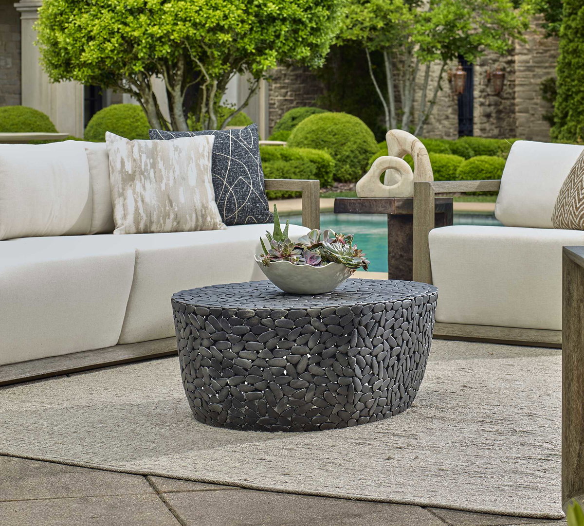 Rivington Outdoor Pebble Coffee Table, Outdoor Table by Uttermost, 3'4" width x 1'3" height x 2'4" depth View 2
